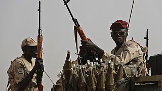 FILE - Sudanese soldiers from the Rapid Support Forces unit, led by Gen. Mohammed Hamdan Dagalo, the deputy head of the military council, secure the area where Dagalo attends 