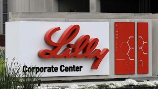 A sign for Eli Lilly & Co. sits outside their corporate headquarters.