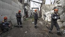 Workers check a transformer damaged by a Russian missile attack at DTEK's power plant in Ukraine, 1 April 2024