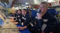 In this photo taken from video released by Russian Defense Ministry Press Service on Tuesday, June 11, 2024, navy personnel take part in drills on board of the Russian Kazan n