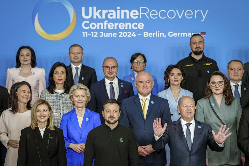 Ukraine's President Volodymyr Zelenskyy (foreground centre) pose for a photo with German Chancellor Olaf Scholz and politicians in Berlin, Tuesday, June 11, 2024.