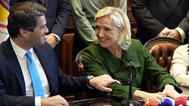 French far-right leader Marine Le Pen and Andre Ventura, leader of Portuguese party Chega, left, look at each other during a news conference at the Portuguese parliament French far-right leader Marine Le Pen and Andre Ventura, leader of Portuguese party Chega, left, look at each other during a news conference at the Portuguese parliament