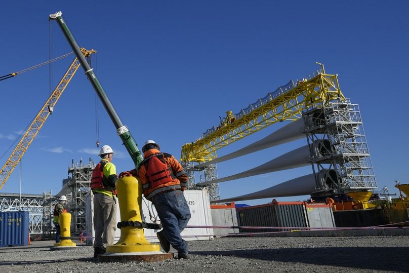 A generator and its blades are prepared for transport to the open ocean for the South Fork Wind farm in New London, CT, December 2023
