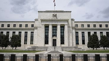 An American flag flies over the Federal Reserve building in Washington