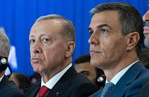 Spanish Prime Minister Pedro Sanchez sits next to Turkish President Recep Tayyip Erdogan, left, during a meeting in Madrid.