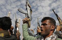 Houthi supporters shout slogans as they raise machine-guns and during a rally against the U.S.-led strikes against Yemen in Sanaa, 17 May 2024