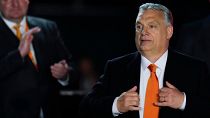 FILE - Hungary's Prime Minister Viktor Orban acknowledges cheering supporters during an election night rally in Budapest, Hungary, Sunday, April 3, 2022. 