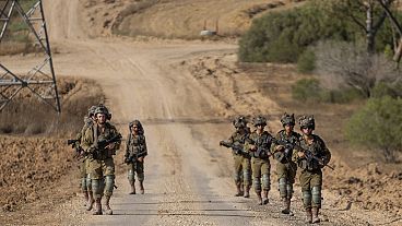 Israeli soldiers are seen near the Gaza Strip border in southern Israel, Thursday, June 13, 2024.