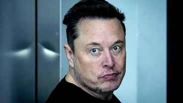 Tesla CEO Elon Musk leaves the Tesla Gigafactory for electric cars after a visit in Gruenheide near Berlin, Germany