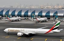 An Emirates plane taxis to a gate at Dubai International Airport at Dubai International Airport in Dubai, United Arab Emirates