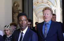 Chris Rock, left, and Conan O'Brien arrive for an audience with Pope Francis