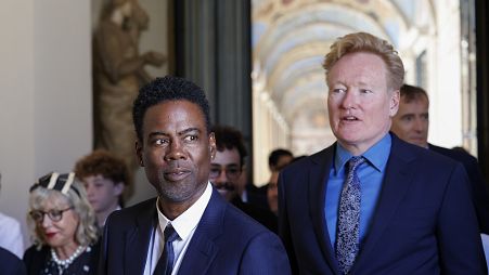 Chris Rock, left, and Conan O'Brien arrive for an audience with Pope Francis