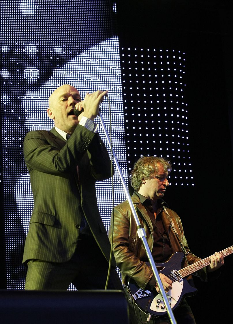 R.E.M. with singer Michael Stipe, left, and guitarist Peter Buck, right, perform at an open air concert in Dresden, eastern Germany in 2008