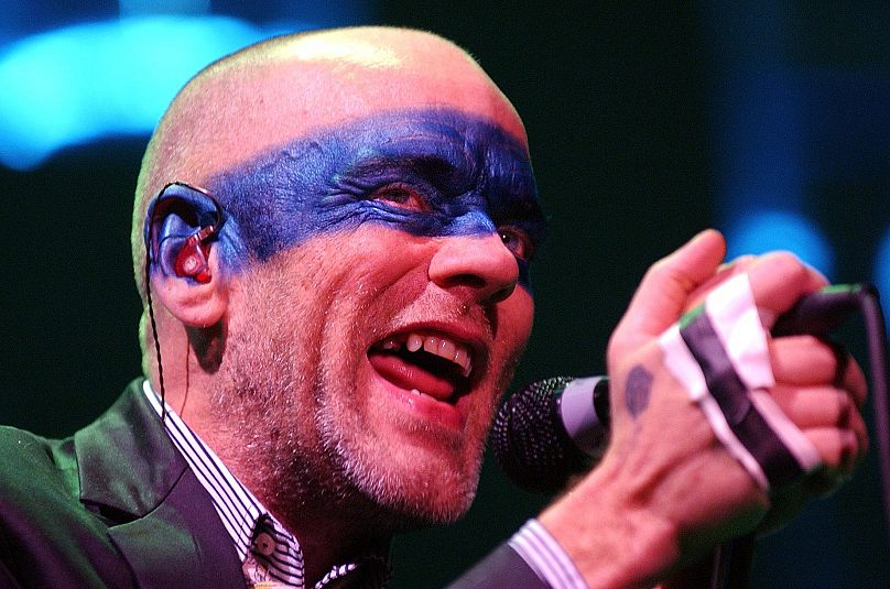 Michael Stipe, singer of US band R.E.M., performs on the stage during a concert at the Arena in Geneva, Switzerland, Wednesday, Jan. 12, 2005.