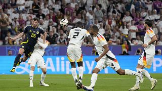 Germany's Antonio Rudiger scores an own goal for Scotland's first during a Group A match between Germany and Scotland at the Euro 2024 in Munich, June 14, 2024