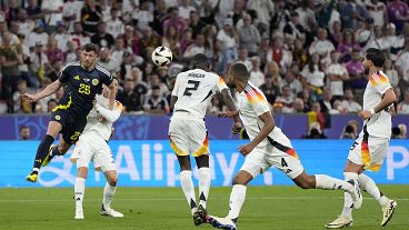 Germany's Antonio Rudiger scores an own goal for Scotland's first during a Group A match between Germany and Scotland at the Euro 2024 in Munich, June 14, 2024