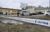 FILE - Police officers stand guard outside Viertola comprehensive school, in Vantaa, Finland, Tuesday, April 2, 2024. 