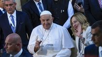 Pope Francis leaves with Italian Prime Minister Giorgia Meloni at the end of a group photo the G7 in Borgo Egnazia, June 14, 2024