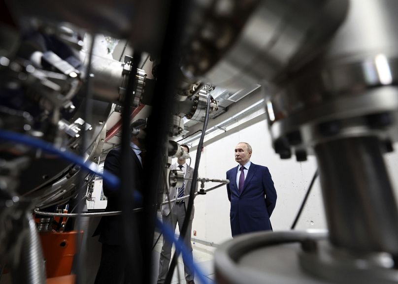 Russian President Vladimir Putin looks at NICA (Nuclotron-based Ion Collider) as he visits the Joint Institute for Nuclear Research, in Dubna.