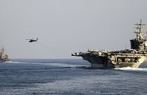 The aircraft carrier USS Dwight D. Eisenhower and other warships crosses the Strait of Hormuz into the Persian Gulf, 26 November 2023