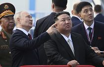 Russian President Vladimir Putin and North Korea's leader Kim Jong Un examine a launch pad during their meeting at the Vostochny cosmodrome, 13 September 2023