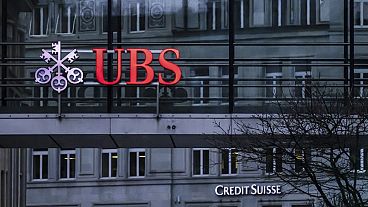 The logos of the Swiss banks Credit Suisse and UBS in Zurich, Switzerland, on March 19, 2023.