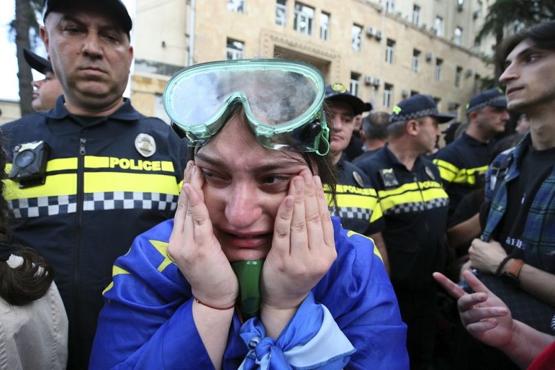 A woman in tears following the approval of the foreign agent law at the Georgian parliament in Tbilisi on May 28 2024