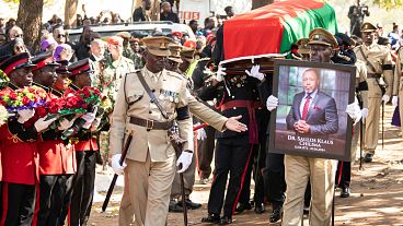 Pallbearers carry the coffin at the burial service for Malawi's Vice President Saulos Chilima in Nsipe, Malawi, Monday, June 17, 2024.