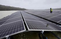 Solar panels are installed at a floating photovoltaic plant on a lake in Haltern. - Copyright AP Photo/Martin Meissner, File