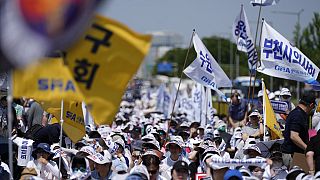 Members of The Korea Medical Association attend at a rally against the government's medical policy in Seoul, South Korea, Tuesday, June 18, 2024. 