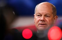 Germany's Chancellor Olaf Scholz speaks with the media as he arrives for an EU summit at the European Council building in Brussels, Monday, June 17, 2024. 
