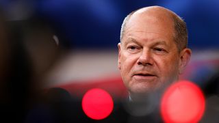 Germany's Chancellor Olaf Scholz speaks with the media as he arrives for an EU summit at the European Council building in Brussels, Monday, June 17, 2024. 