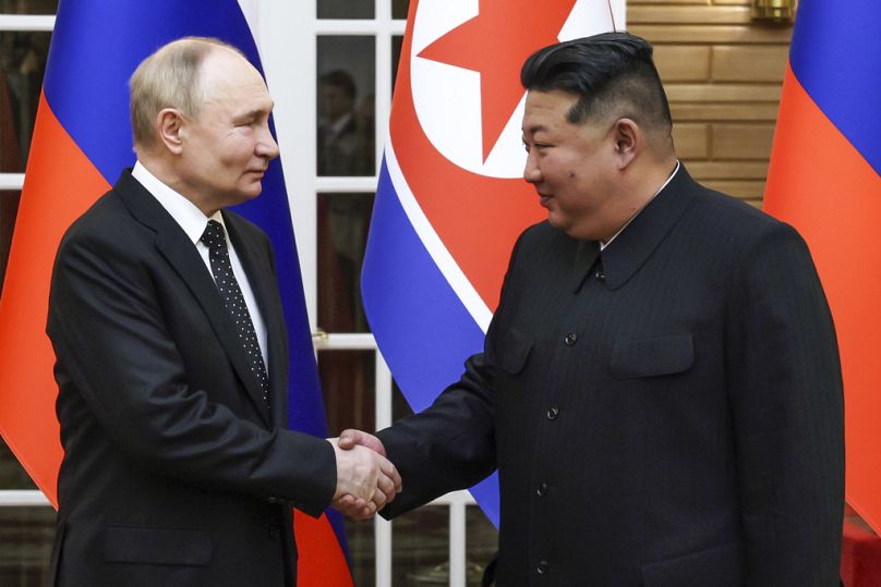 Russian President Vladimir Putin, left, and North Korea's leader Kim Jong Un shake hands prior to their talks in Pyongyang, North Korea, on Wednesday, June 19, 2024. 
