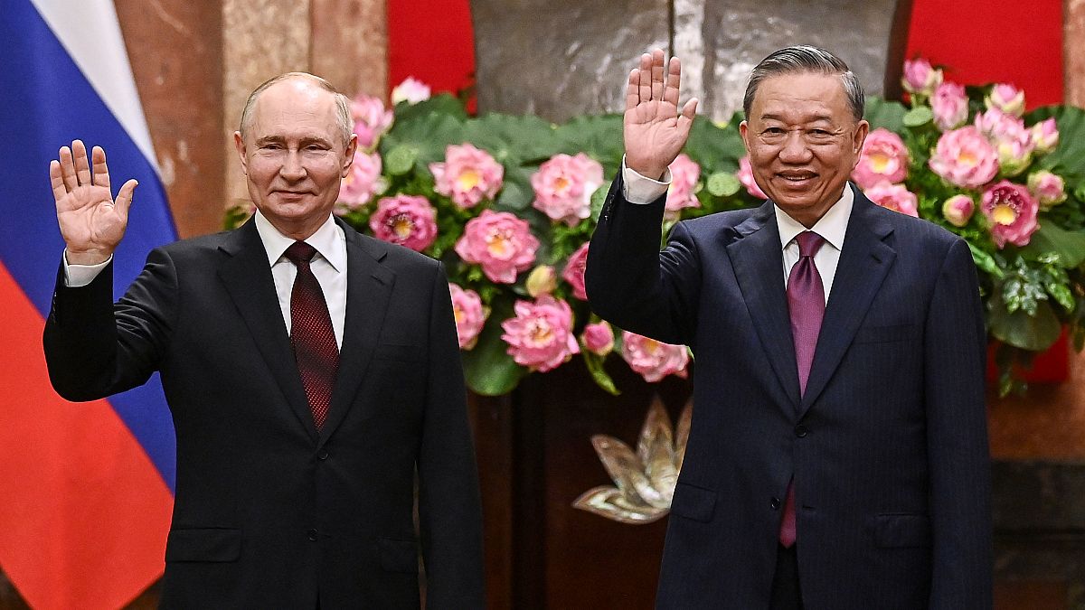 Russian President Vladimir Putin, left, and Vietnam's President To Lam pose for photos at the Presidential Palace in Hanoi, Vietnam Thursday, June 20, 2024. (Nhac Nguyen/Pool 