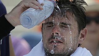 Stan Wawrinka, of Switzerland, pours water on his face during a changeover in his match against Ugo Humbert, of France, during the second round of the U.S. Open.