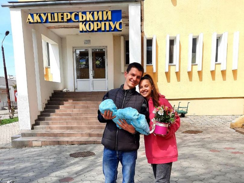 Anastasiia and her husband after she has given birth to her son.