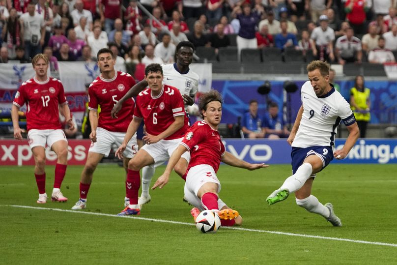 England's Harry Kane scores the opening goal against Denmark
