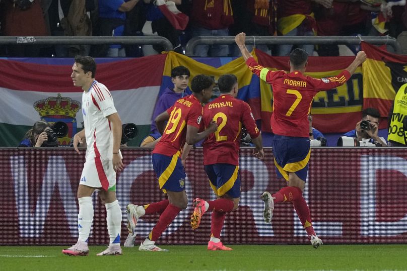 Spain celebrate as Italy's Riccardo Calafiori scores an own goal at minute 55'