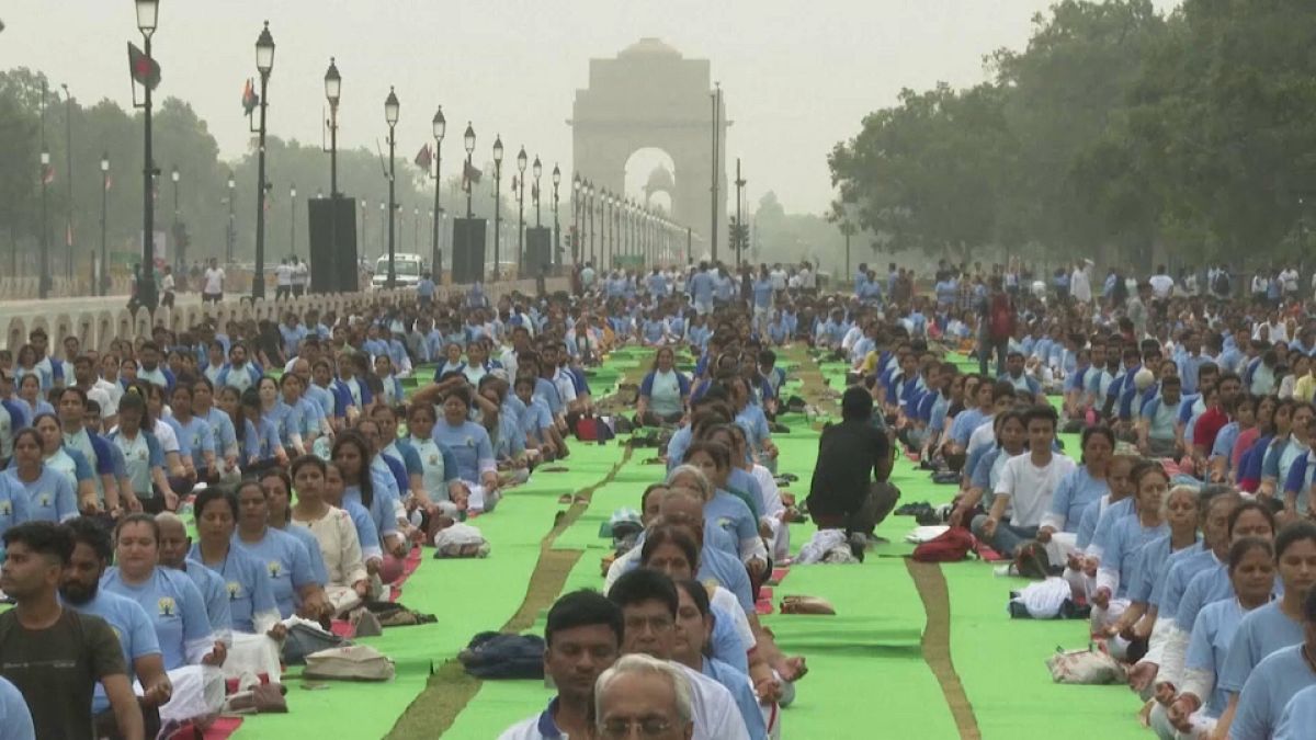 People practice Yoga at the the ceremonial Kartavya Path boulevard to mark international Yoga Day in New Delhi, India, Friday, June 21, 2024. 