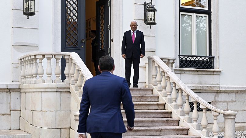 Former Portuguese caretaker prime minister Antonio Costa, rear, welcomes Luis Montenegro, the current prime minister, for a meeting at the Sao Bento palace, Lisbon