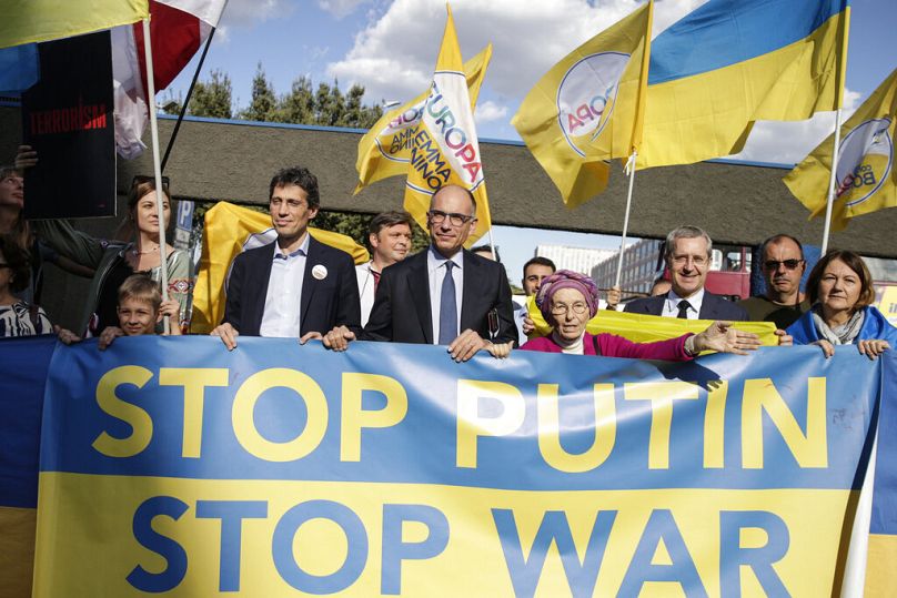 Enrico Letta, center, participates in a march with the Ukrainian community in Rome organized by the '+ Europa' (More Europe) party led by long-time civil rights campaigner, an