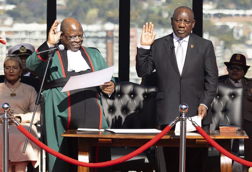 South Africa's Cyril Ramaphosa, is sworn in as President by Chief Justice Raymond Zondo, left, at his inauguration at the Union Buildings in Tshwane, South Africa, Wednesday, 