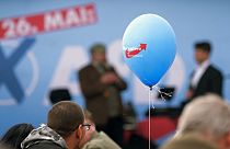 People attend an event during the street Europe and communal election campaigning of the far-right Alternative for Germany AfD