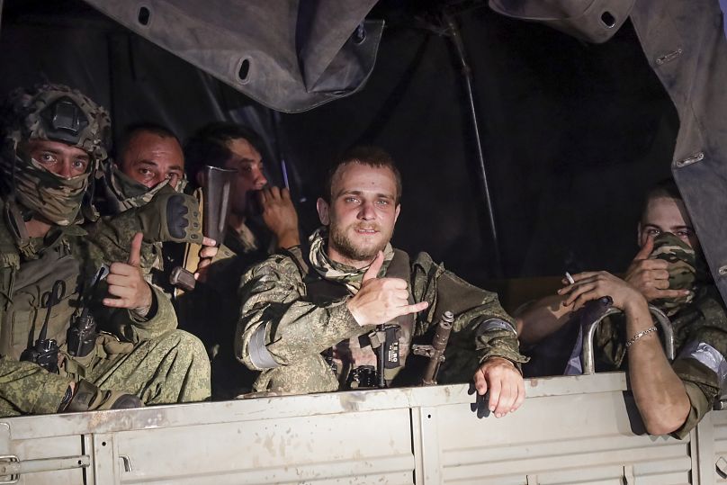 Members of the Wagner Group private military contractor sit in vehicle in Rostov-on-Don, Russia, on June 24, 2023.