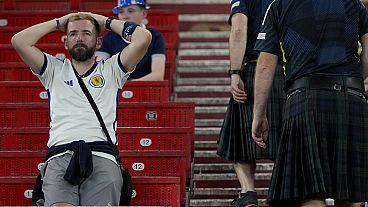 Scotland fans dejected as their team are knocked out of Euro 2024 following a defeat against Hungary