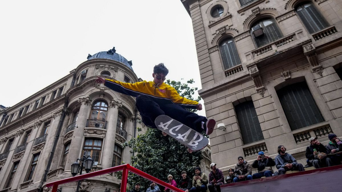 A skater jumps in a performance for Go Skateboarding Day 2024 in Santiago, Chile on Sunday