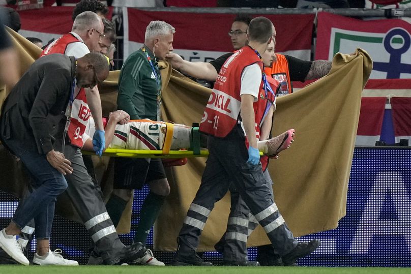 Hungary's Barnabas Varga is strechered out after being injured during a Group A match between Scotland and Hungary at the Euro 2024 tournament in Stuttgart, Germany