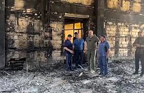 The head of Dagestan Republic Sergei Melikov, center, visits the damaged Kele-Numaz synagogue in Derbent after a counter-terrorist operation in republic of Dagestan, Russia. 