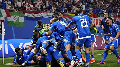 Italian players celebrate after teammate Mattia Zaccagni scored during a Group B match between Croatia and Italy at Euro 2024