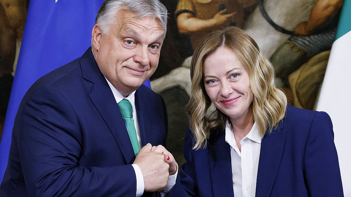 Italy's Prime Minister Giorgia Meloni, right, gestures with her Hungarian counterpart Viktor Orban, during a press conference at Chigi Palace government office in Rome,